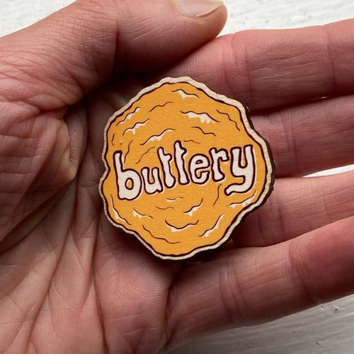 Buttery wooden badge